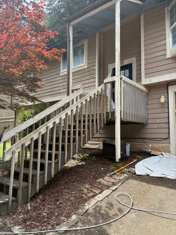 Protected entry stairs and siding during exterior painting prep