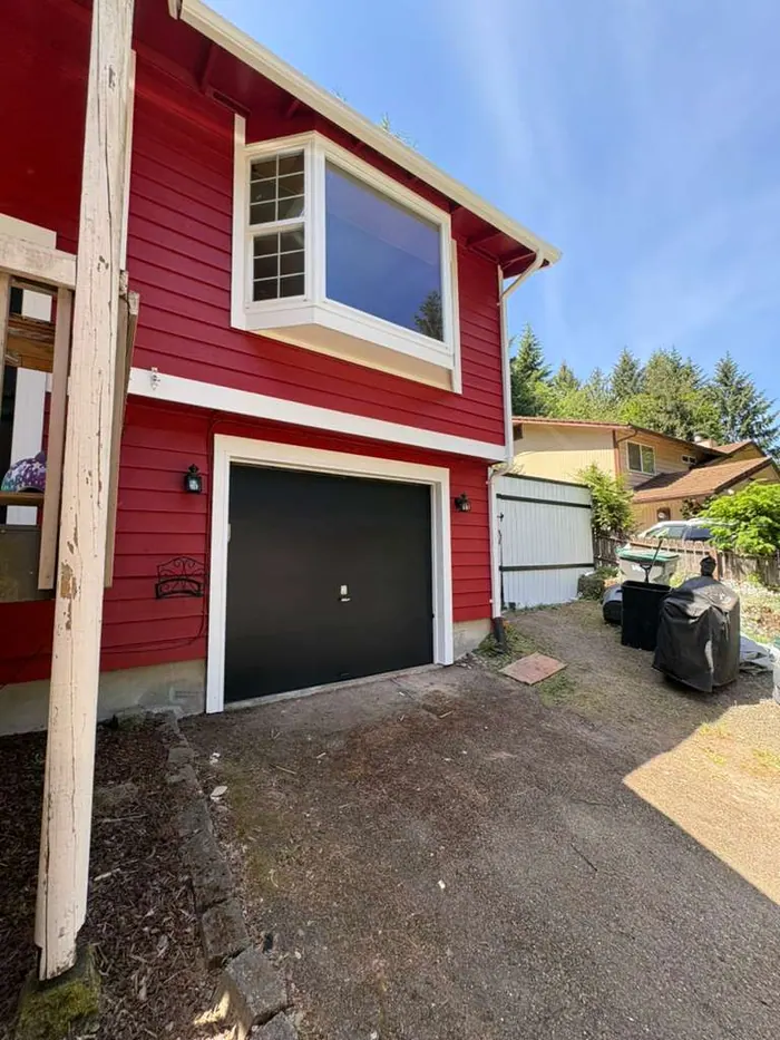 Finished red exterior repaint around front entry and garage