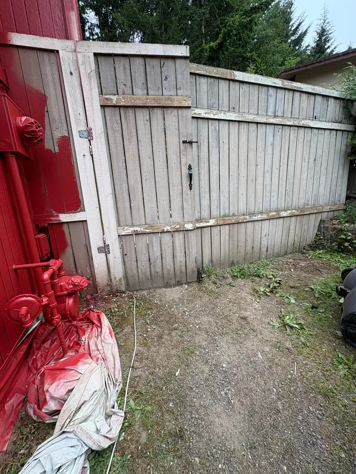 Before photo of fence section prior to sanding prep and refinishing